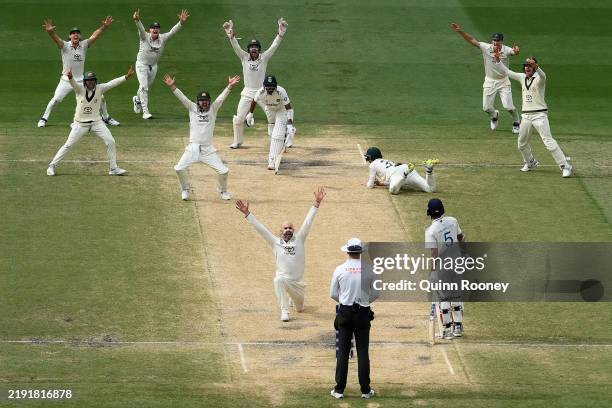 Nathan Lyon celebrates after trapping Mohammed Siraj lbw as Australia won the match during day five of the Men's Fourth Test Match in the series...