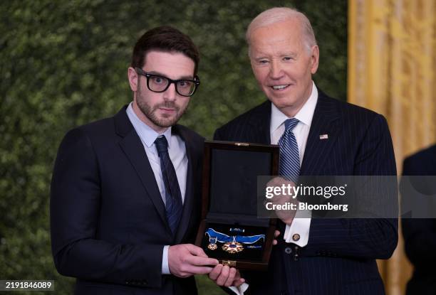 President Joe Biden Alex Soros, son of award recipient George Soros, billionaire and founder of Soros Fund Management LLC, with the Medal of Freedom...