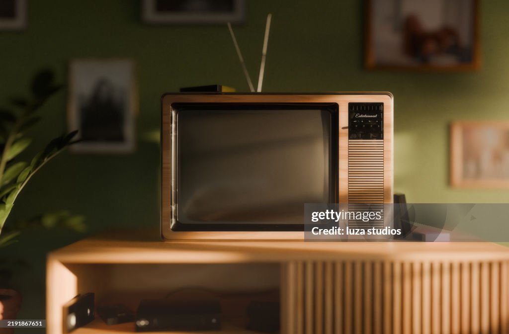 Retro TV in a vintage living room interior with green walls and retro furniture