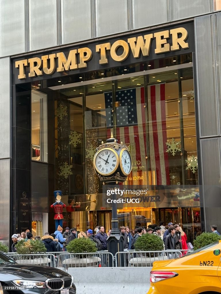 Large group of people, tourist, tourism, front entrance, Trump Tower, Fifth Avenue, Manhattan, New York, Facade, clock, American flag, holiday, building exterior, street