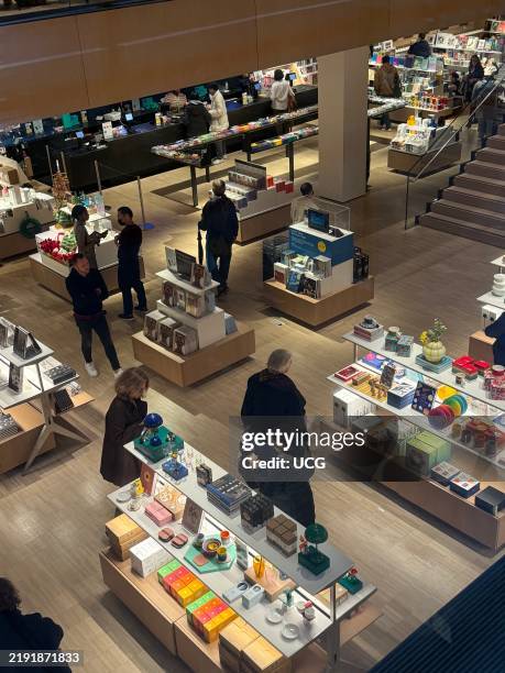 View of the MOMA museum gift shop with tourists shopping, Manhattan, New York.