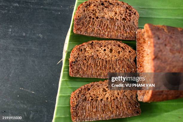 loaf sponge cake made from palm sugar on bamboo tray - jaggery stock pictures, royalty-free photos & images