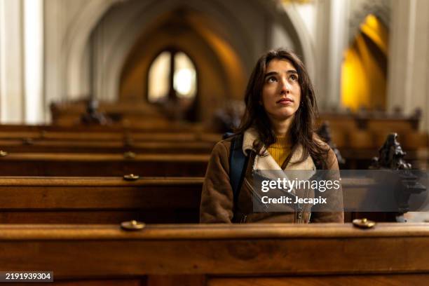 young woman contemplating in cathedral - religion bildbanksfoton och bilder