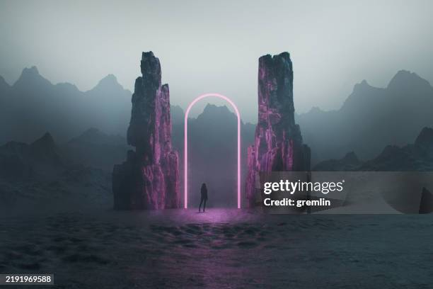 young woman walking in fantasy landscape - woman walking out door silhouette stock pictures, royalty-free photos & images