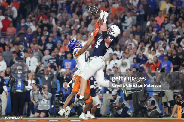 Tyler Warren of the Penn State Nittany Lions catches a pass for a touchdown over Ty Benefield of the Boise State Broncos during the third quarter in...
