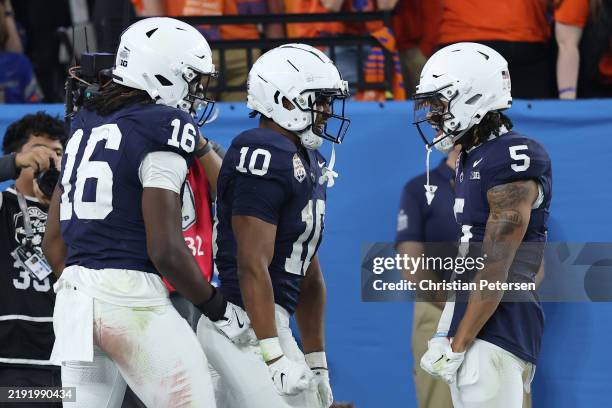 Nicholas Singleton of the Penn State Nittany Lions celebrates his touchdown run with teammates during the fourth quarter against the Boise State...