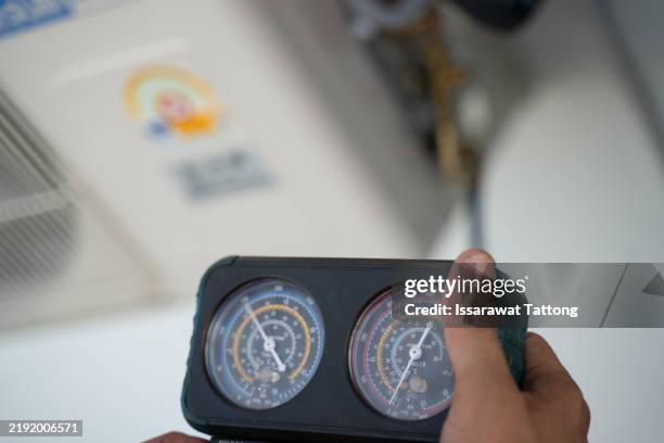a person is holding a device that has two dials on it - lazer quest stock pictures, royalty-free photos & images