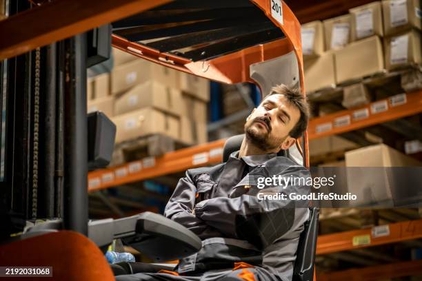 forklift operator sleeping at work - laziness stock pictures, royalty-free photos & images