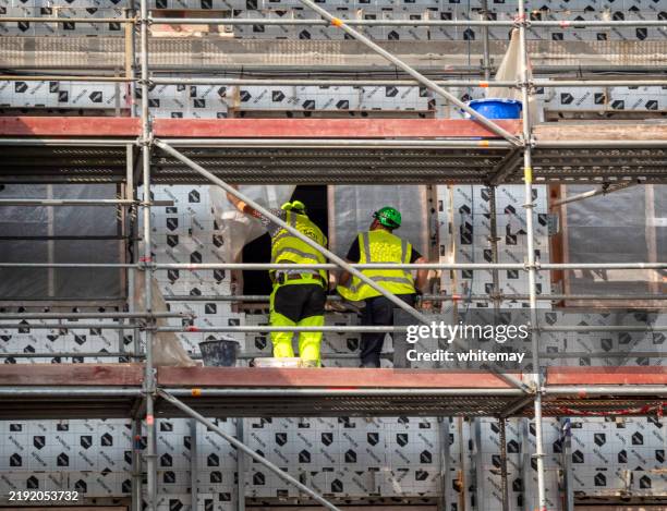 construction workers in aarhus, denmark - construction-worker stockfoto's en -beelden
