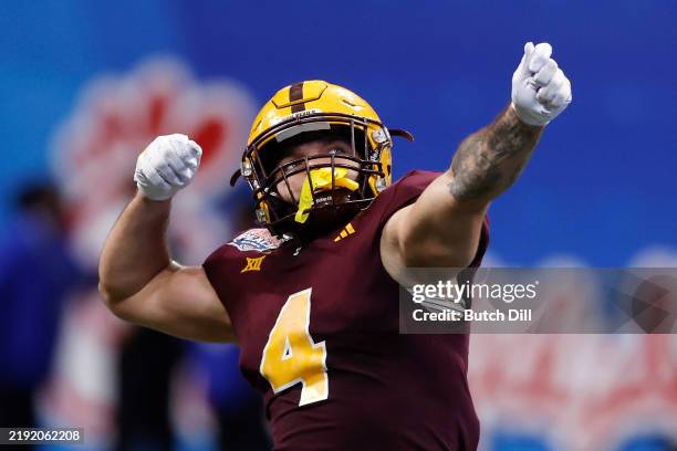 Cam Skattebo of the Arizona State Sun Devils reacts after throwing a pass for a touchdown during the fourth quarter against the Texas Longhorns in...