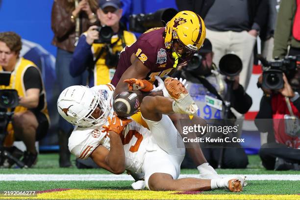 Malik Muhammad of the Texas Longhorns breaks up a pass intended for Malik McClain of the Arizona State Sun Devils during overtime in the Chick-fil-A...