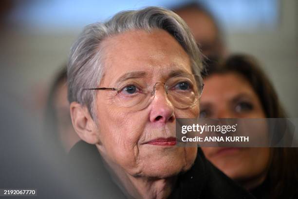 France's Minister of Education, Higher Education and Research Elisabeth Borne looks on as she visits the French elementary school Helene Boucher for...