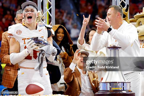 Taaffe Michael Taaffe of the Texas Longhorns reacts as he lifts the trophy ...