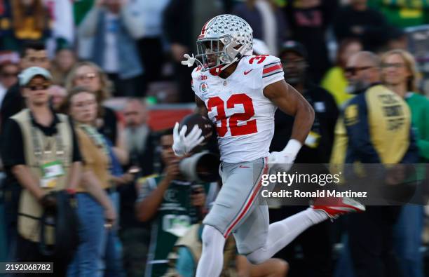 TreVeyon Henderson of the Ohio State Buckeyes scores a touchdown during the second quarter against the Oregon Ducks during the Rose Bowl Game...