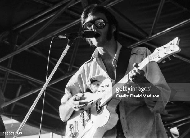 Neil Young of Crosby, Stills, Nash and Young performs at the Day on the Green concert on July 13, 1974 at the Oakland Coliseum in Oakland, California.