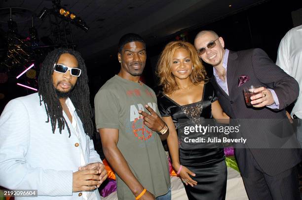 Rapper Lil Jon , singers Glenn Lewis and Christina Milian, and rapper Pitbull attend the BMI Urban Awards on August 26, 2005 at the Fontainebleau...