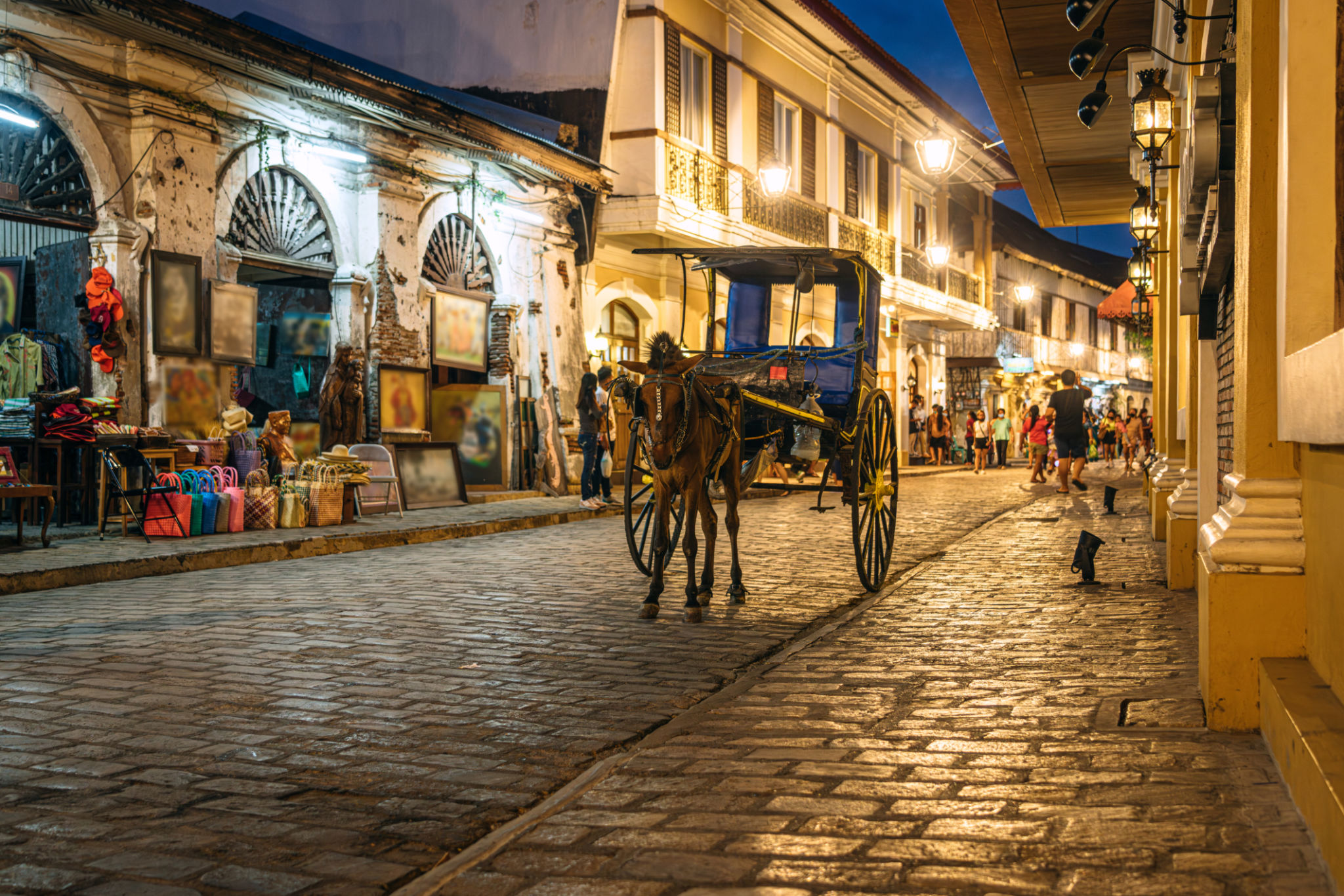 Horse Carriage on a Historic Street in in Vigan, Philippines Horse Carriage on a Historic Street in in Vigan, Philippines
