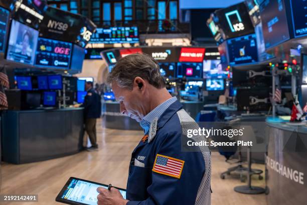 Traders work on the floor of the New York Stock Exchange on the first day of trading of the new year on January 02, 2025 in New York City. The Dow...