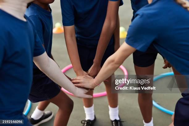students huddling in schoolyard - unrecognisable person stock pictures, royalty-free photos & images