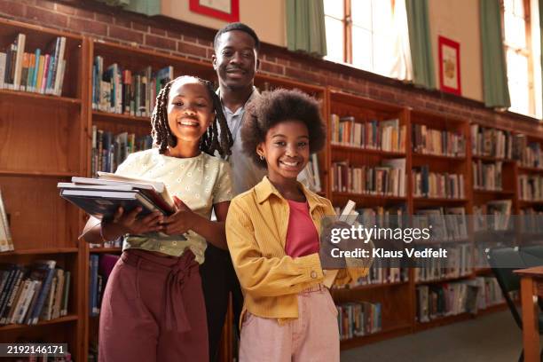 smiling students standing with professor - wine library stock pictures, royalty-free photos & images