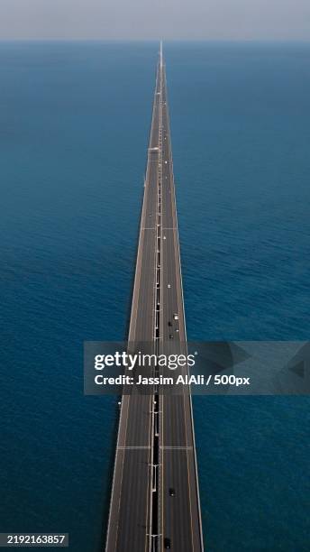 aerial view of bridge over sea,al kuwayt,kuwait - kuwait landscape stock pictures, royalty-free photos & images
