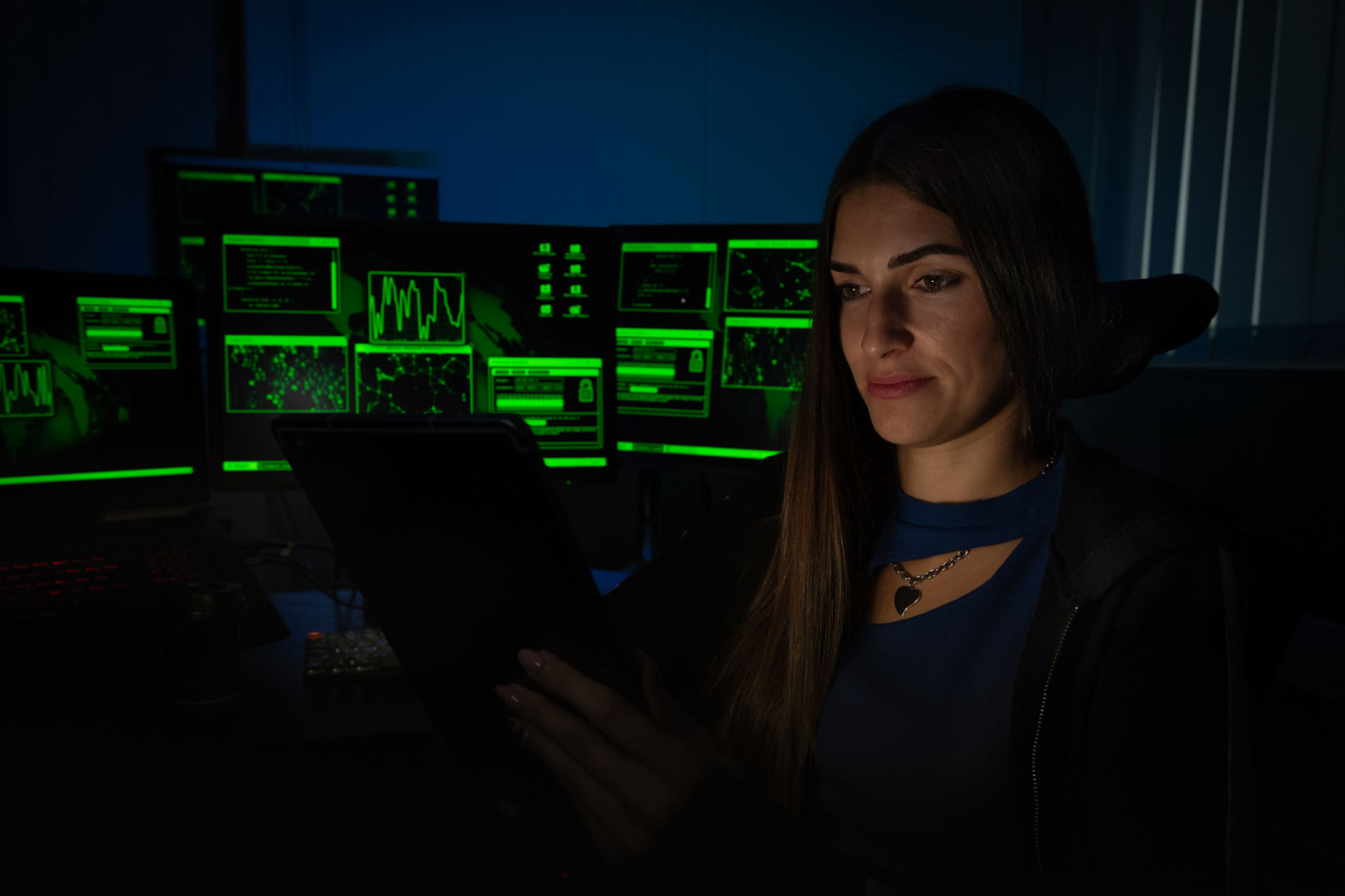 Programmer in front of computer screens at night. Programmer in front of computer screens at night.