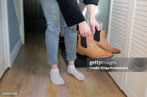 taking shoes off - barefoot stock pictures, royalty-free photos & images