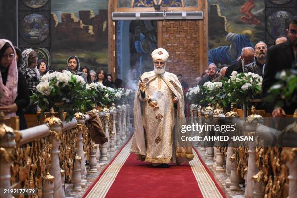 Priest leads Orthodox Christmas Eve celebrations at the Archangel Michael Coptic Orthodox Church in Cairo on January 6, 2025.