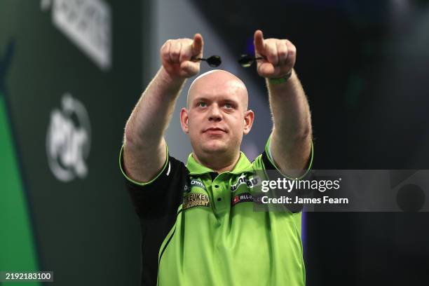 Michael van Gerwen of the Netherlands celebrates victory in his Semi-Final match against Chris Dobey of England on day fifteen of the 2024/25 Paddy...