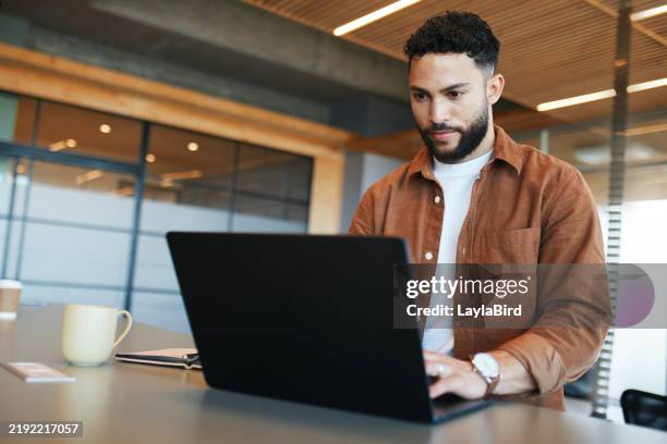 focused professional working on laptop - using laptop stock pictures, royalty-free photos & images