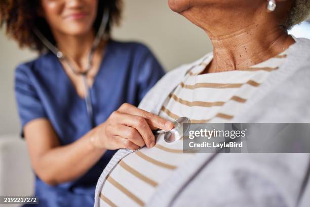 heartfelt healthcare: doctor's gentle examination - stetoskop bildbanksfoton och bilder