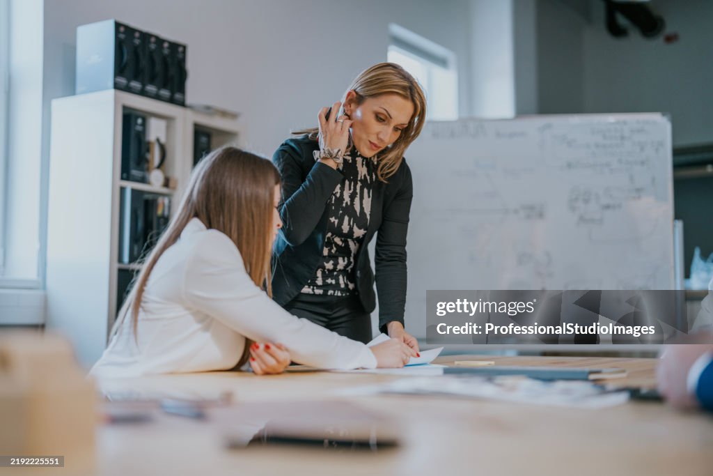 Professional teamwork discussion in a modern office environment with focus on collaboration