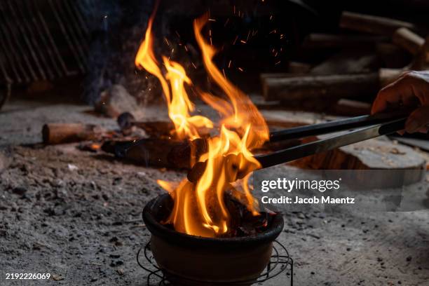 juanita torremacho, a folk healer prepares medicine over a fire - traditional ceremony stock pictures, royalty-free photos & images