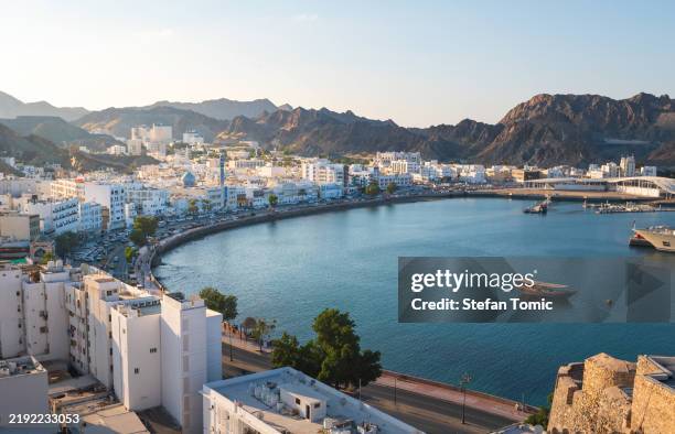 breathtaking view of muscat, capital city of oman at sunset - arabian sea stock pictures, royalty-free photos & images