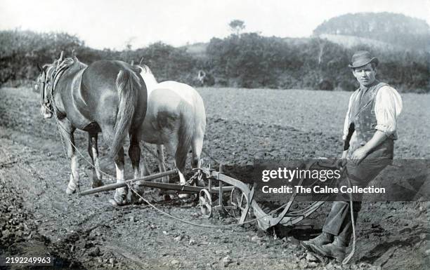 Photo postcard farmer ploughing field with two horses Canada c. 1910 Photo postcard farmer ploughing field with two horses Canada c. 1910