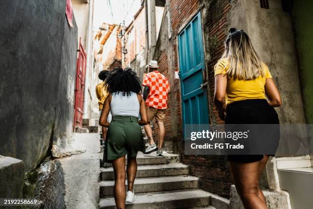 tourist walking in the favela in brazil - slum stock pictures, royalty-free photos & images
