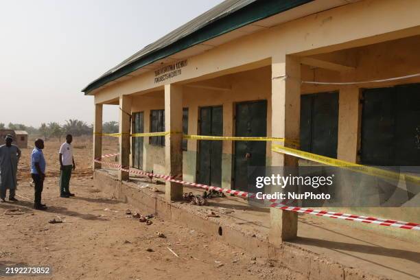 Police caution tapes are seen on the school pillars after a suspected explosive device kills two students on January 7 at Tsangagyan Sani Uthman...