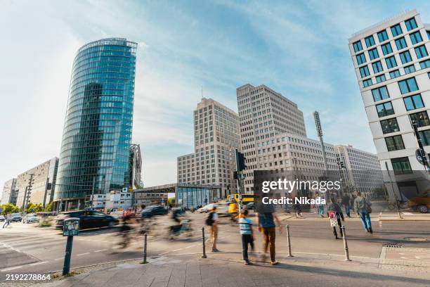 berlin potsdamer platz with high-rise buildings and busy urban street in berlin - pedestrian zone stock pictures, royalty-free photos & images