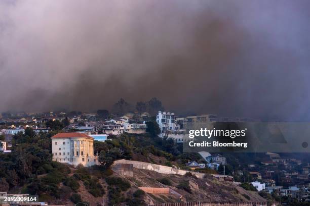 Smoke from the Palisades Fire rises over the Pacific Coast Highway in Malibu, California, US, on Tuesday, Jan. 7, 2025. Wildfires broke out in Los...