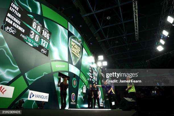 Luke Littler of England throws during the Final against Michael van Gerwen of The Netherlands during day sixteen of the 2024/25 Paddy Power World...