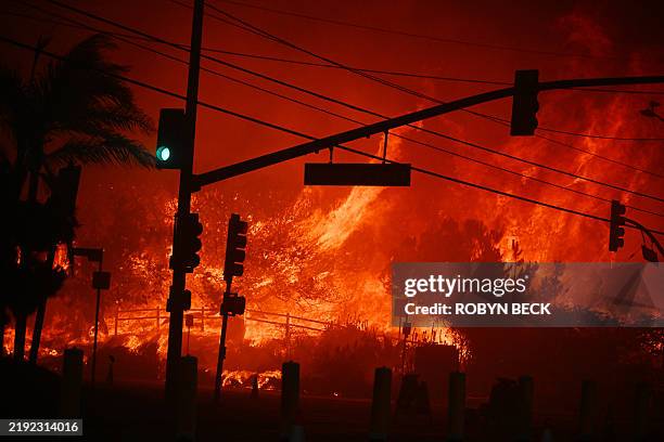 Flames overtake the intersection of Temescal Canyon and Pacific Coast Highway Fire at the Palisades Fire in Pacific Palisades California on January...