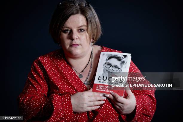 Severine Vermard, the mother of Lucas, a teenager from Vosges whose suicide in 2023 at the age of 13 sparked national emotion, holds her book...