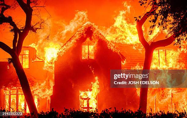 Home is engulfed in flames during the Eaton fire in the Altadena area of Los Angeles County, California on January 8, 2025.