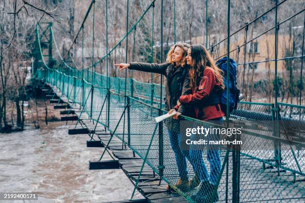 lesbian couple traveling around europe - pioneer bridge stock pictures, royalty-free photos & images