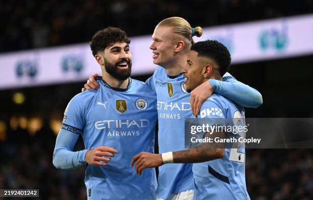 Erling Haaland celebrates scoring his team's third goal with teammates Josko Gvardiol and Savinho of Manchester City during the Premier League match...