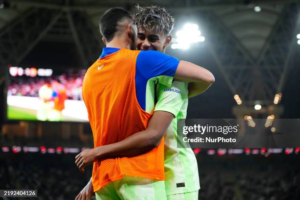 Lamine Yamal right winger of Barcelona and Spain celebrates after scoring his sides first goal during the Spanish Super Cup semi-final match between...