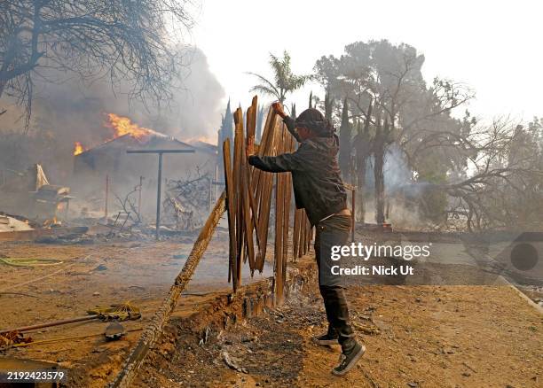 January 09: Fires burn from the Eaton Fire in the Altadena neighborhood on January 09, 2025 in PASADENA, CALIFORNIA. A spokesperson for the Los...
