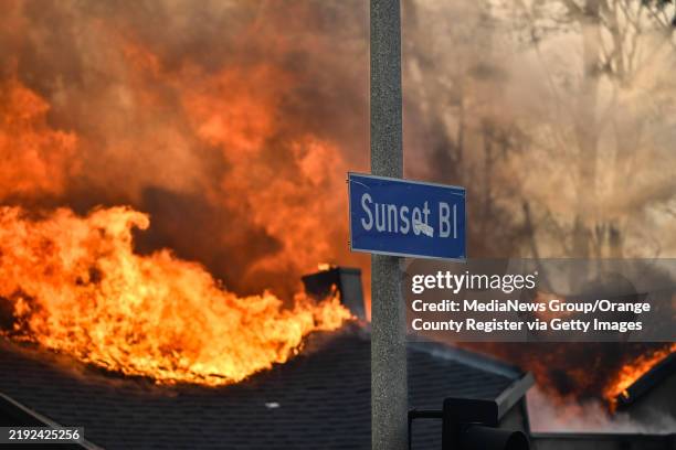 Pacific Palisades, CA A home burns along Sunset Boulevard during the Palisades Fire on Wednesday, January 8 in Pacific Palisades, CA.