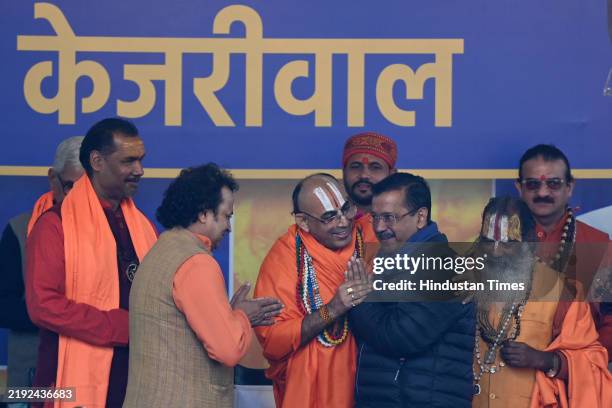 Hindu priests join Aam Aadmi Party in presence of AAP convener Arvind Kejriwal at AAP HQ, ahead of Delhi assembly election on January 8, 2025 in New...