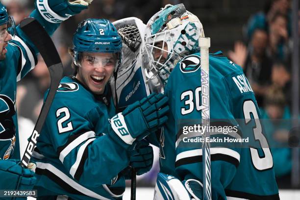 Goaltender Yaroslav Askarov of the San Jose Sharks celebrates with Will Smith after their win over the New Jersey Devils at SAP Center on January 04,...
